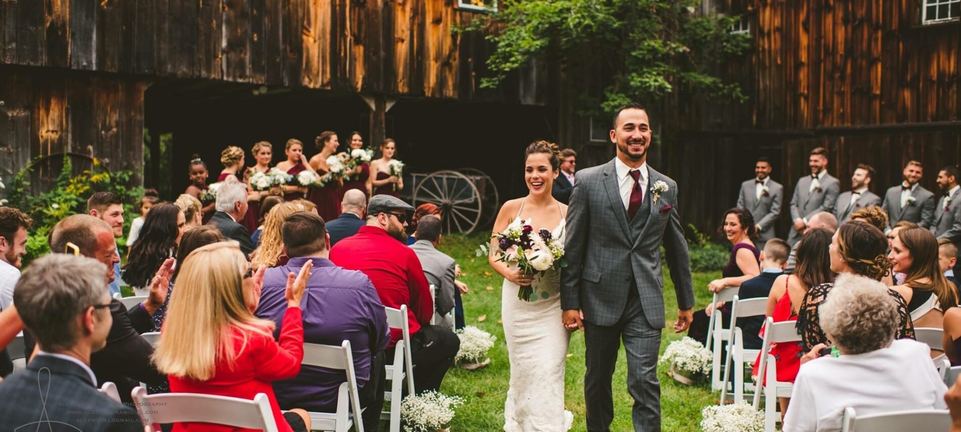 Bride and Groom walking down Isle